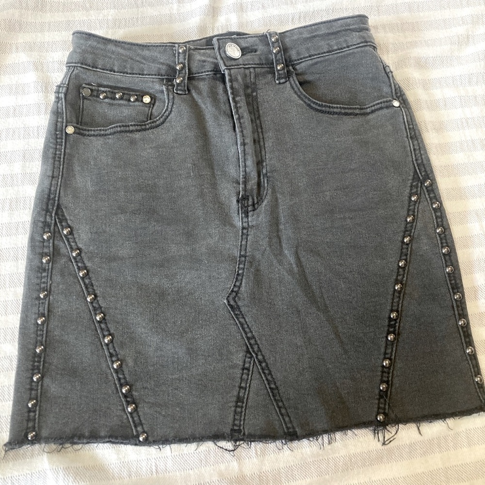 stretchy denim skirt worn stud embellishments